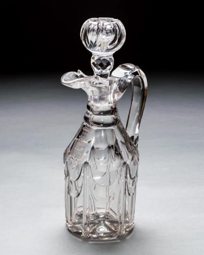 A WILLIAM IV ARMOURIAL CLARET JUG