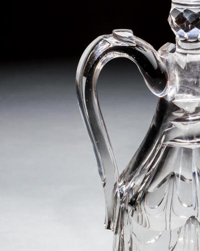 A WILLIAM IV ARMOURIAL CLARET JUG