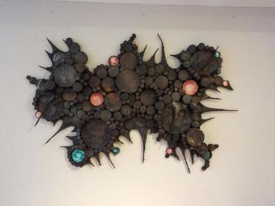 A Wall Sculpture in Blackened Steel and Ceramic