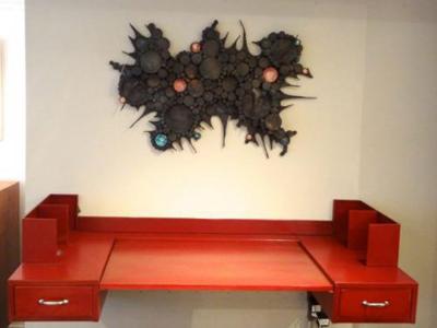 A Wall Sculpture in Blackened Steel and Ceramic