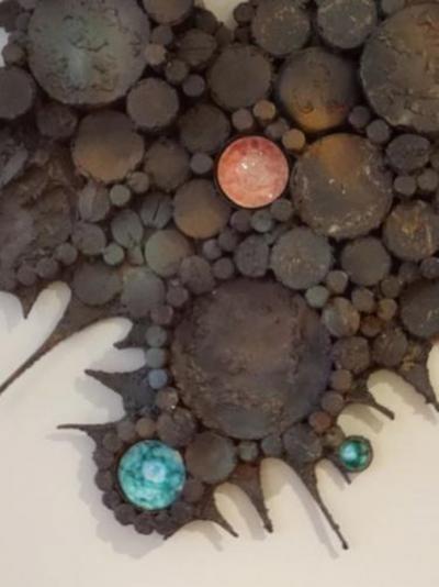 A Wall Sculpture in Blackened Steel and Ceramic