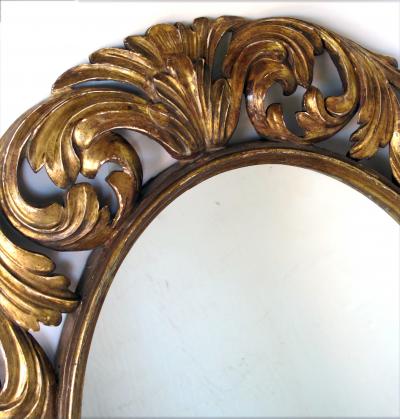 A Well Carved Italian Baroque Style Oval Gilt Wood Mirror