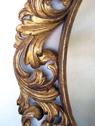 A Well Carved Italian Baroque Style Oval Gilt Wood Mirror