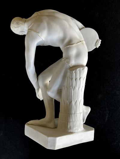 A Well defined Italian Bisque Figure of a Discus Thrower