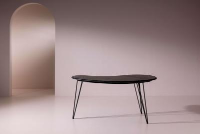 A bean shaped table made of dark slate and iron Italy late 1950s