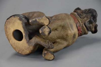 A charming late 19th century Austrian seated terracotta Pug dog