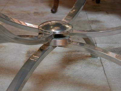 A chic Italian 1960s nickel plated cocktail table with glass top