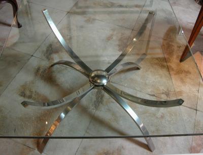 A chic Italian 1960s nickel plated cocktail table with glass top