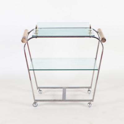 A chrome and glass bar cart with brass details and removable tray C 1980 