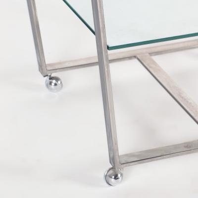 A chrome and glass bar cart with brass details and removable tray C 1980 