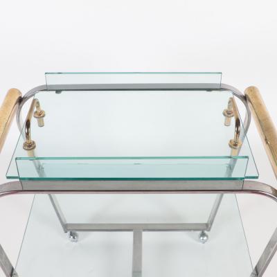 A chrome and glass bar cart with brass details and removable tray C 1980 