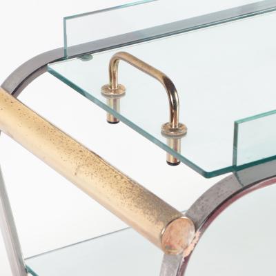 A chrome and glass bar cart with brass details and removable tray C 1980 