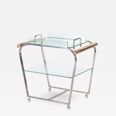 A chrome and glass bar cart with brass details and removable tray C 1980 