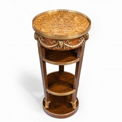 A circular mahogany gueridon in manner of Zwiener