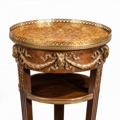 A circular mahogany gueridon in manner of Zwiener