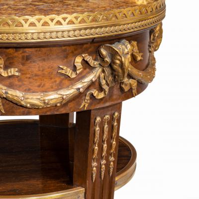 A circular mahogany gueridon in manner of Zwiener