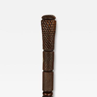 A cleverly carved mahogany walking cane