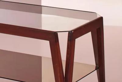 A coffee table made of wood and glass Italy 1950s