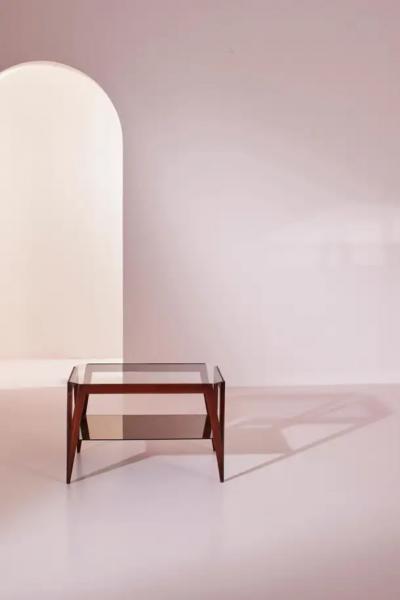 A coffee table made of wood and glass Italy 1950s