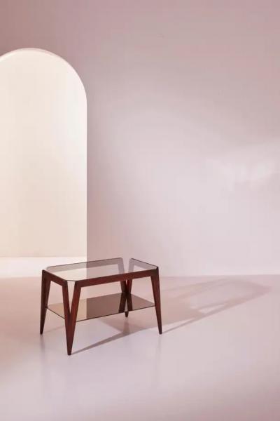 A coffee table made of wood and glass Italy 1950s