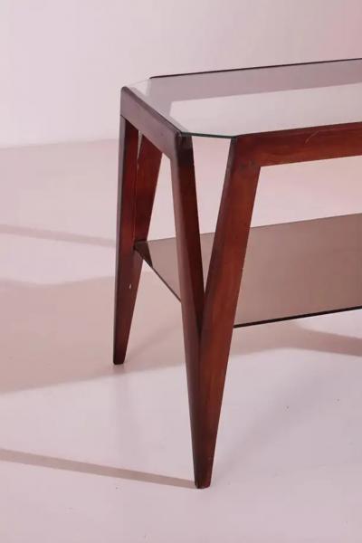 A coffee table made of wood and glass Italy 1950s
