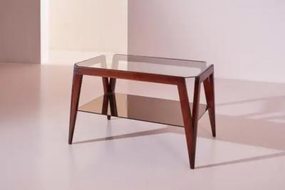 A coffee table made of wood and glass Italy 1950s