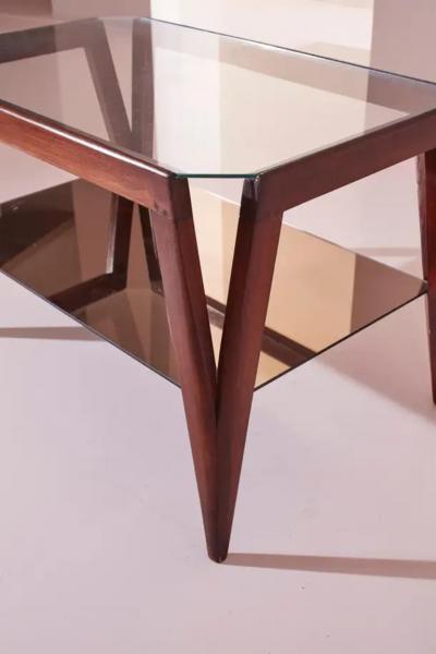 A coffee table made of wood and glass Italy 1950s