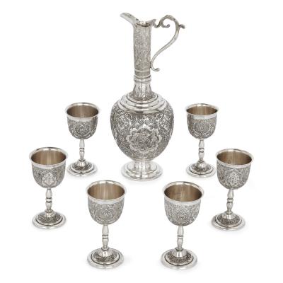 A collection of Persian silverware and tableware
