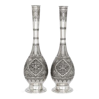 A collection of Persian silverware and tableware