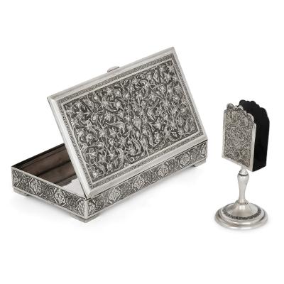 A collection of Persian silverware and tableware