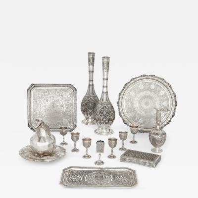 A collection of Persian silverware and tableware