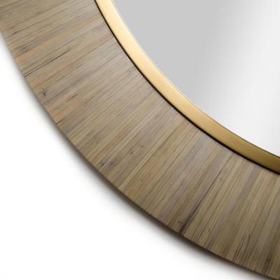 A contemporary modernist round mirror executed in meticulous straw marquetry 