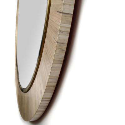 A contemporary modernist round mirror executed in meticulous straw marquetry 