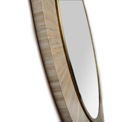 A contemporary modernist round mirror executed in meticulous straw marquetry 