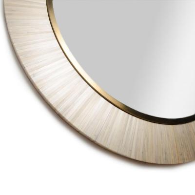 A contemporary modernist round mirror executed in meticulous straw marquetry 