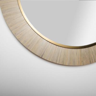 A contemporary modernist round mirror executed in meticulous straw marquetry 