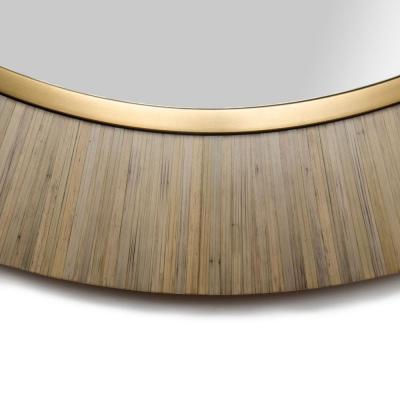 A contemporary modernist round mirror executed in meticulous straw marquetry 