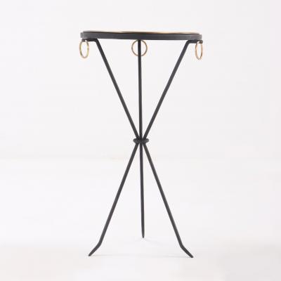 A contemporary pair of wrought iron drink tables having ring decoration 