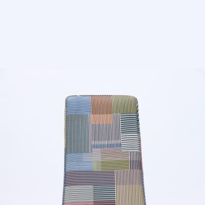 A contemporary tall back side chair covered in Paul Smith fabric 