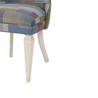 A contemporary tall back side chair covered in Paul Smith fabric 