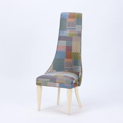 A contemporary tall back side chair covered in Paul Smith fabric 