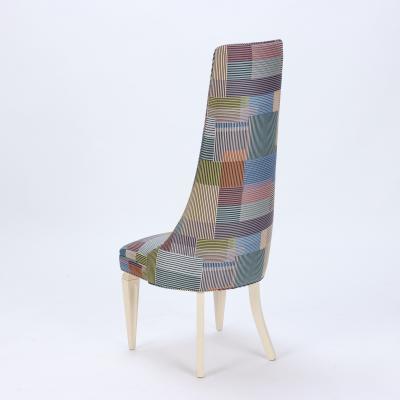 A contemporary tall back side chair covered in Paul Smith fabric 