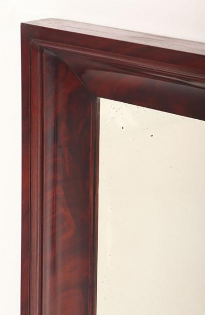 A crotch mahogany Empire wall mirror circa 1830