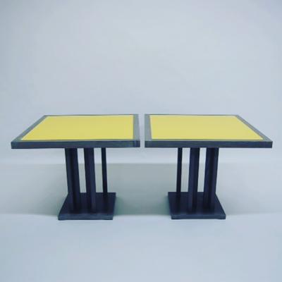A custom pair of small cerused oak dining tables with yellow lacquered top