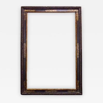 A dramatically large carved gilded and polychrome Spanish Baroque period frame 