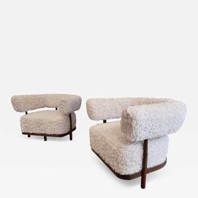 A fabulous pair of Italian curved walnut armchairs in lambswool fur