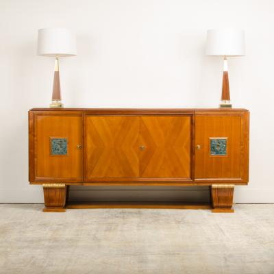 A fine French 1940s walnut veneer with gilded carved wood details sideboard
