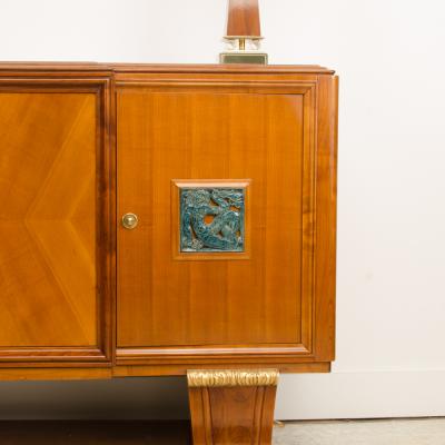 A fine French 1940s walnut veneer with gilded carved wood details sideboard