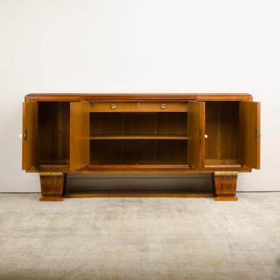A fine French 1940s walnut veneer with gilded carved wood details sideboard