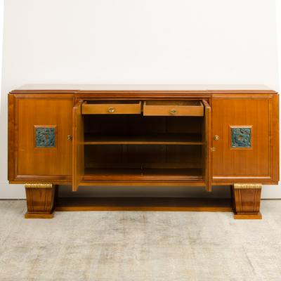 A fine French 1940s walnut veneer with gilded carved wood details sideboard